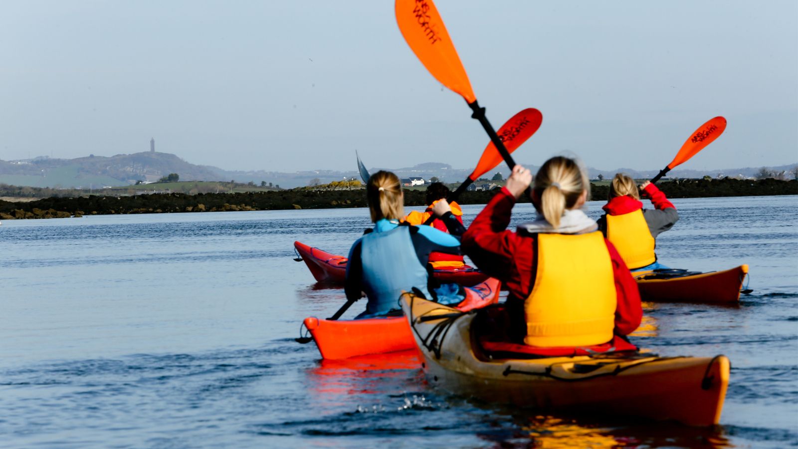Kayaking on Strangford Lough overlooked by Scrabo Tower